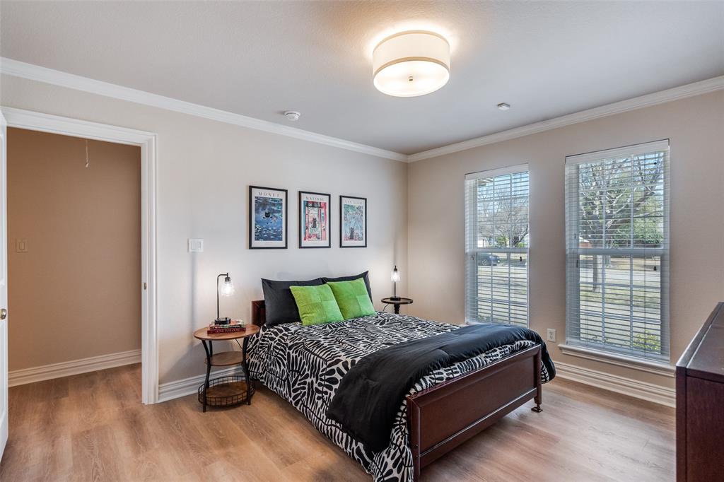 6604 Villa Road Dallas, TX 75252 - Photo 22 of 28 a bedroom with a bed and a window