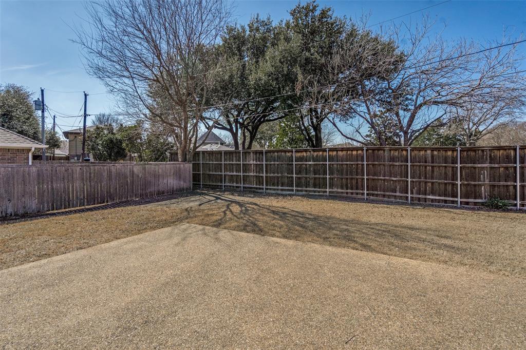 6604 Villa Road Dallas, TX 75252 - Photo 26 of 28 a view of a yard with wooden fence
