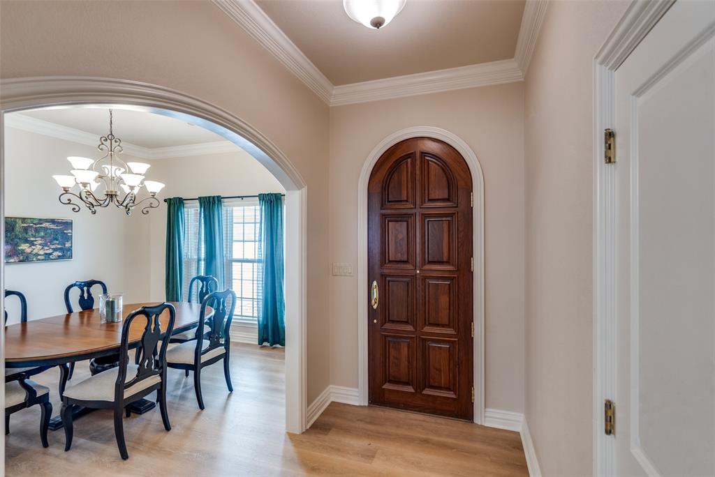 6604 Villa Road Dallas, TX 75252 - Photo 3 of 28 a view of a dining room with furniture and chandelier