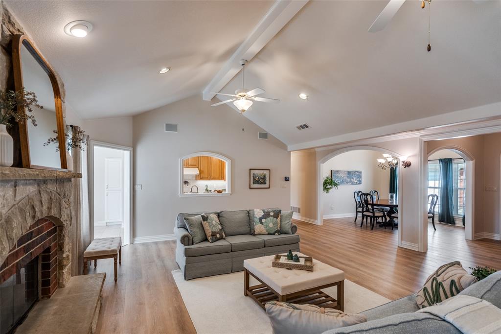 6604 Villa Road Dallas, TX 75252 - Photo 5 of 28 a living room with furniture and a fireplace