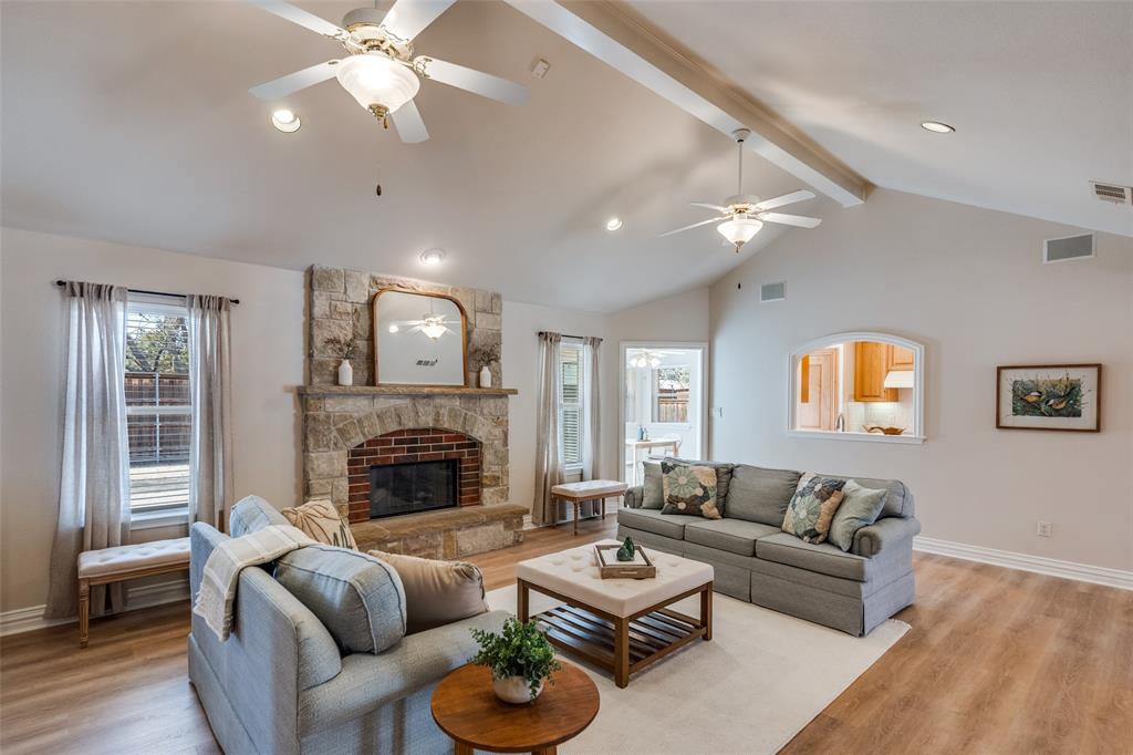 6604 Villa Road Dallas, TX 75252 - Photo 6 of 28 a living room with furniture and a fireplace