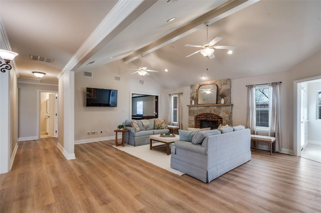 6604 Villa Road Dallas, TX 75252 - Photo 8 of 28 a living room with furniture and a flat screen tv
