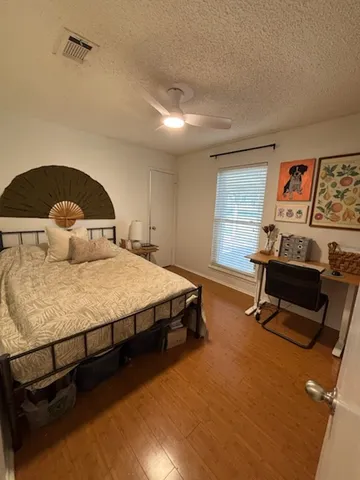 a bedroom with a bed and furniture