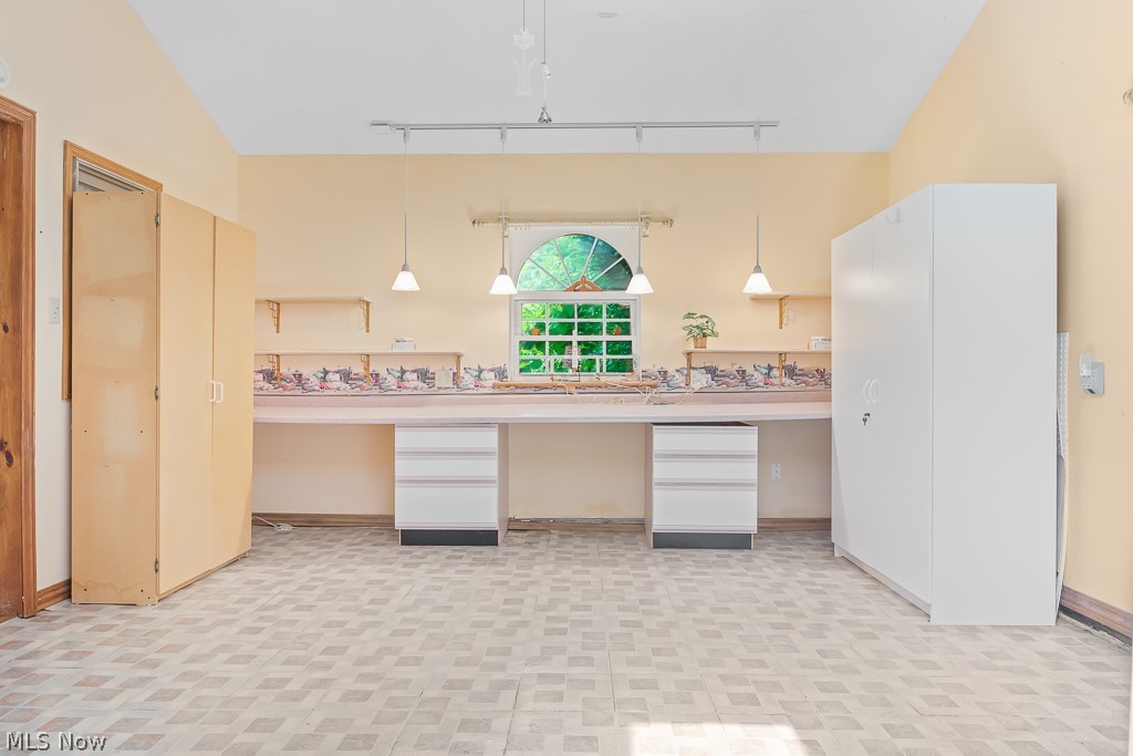 9712 Nichols Road Windham, OH 44288 - Photo 23 of 50 Kitchen with hanging light fixtures, track lighting, and vaulted ceiling
