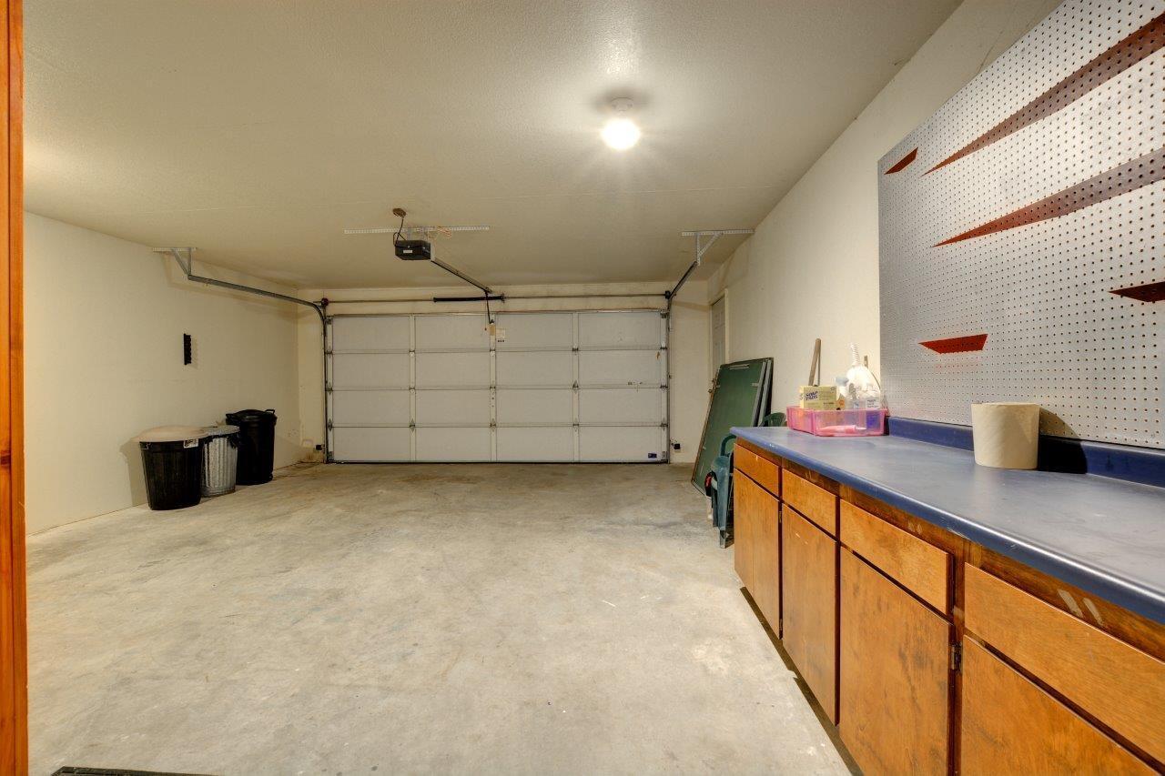 10470 Galice Road Merlin, OR 97532 - Photo 29 of 48 Garage has wonderful storage. Door on far right leads out to deck (see next picture)