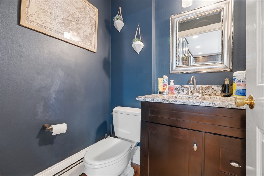 33 Mystic Street, Unit 3 Boston, MA 02129 - Photo 16 of 21 a bathroom with a toilet a sink and mirror