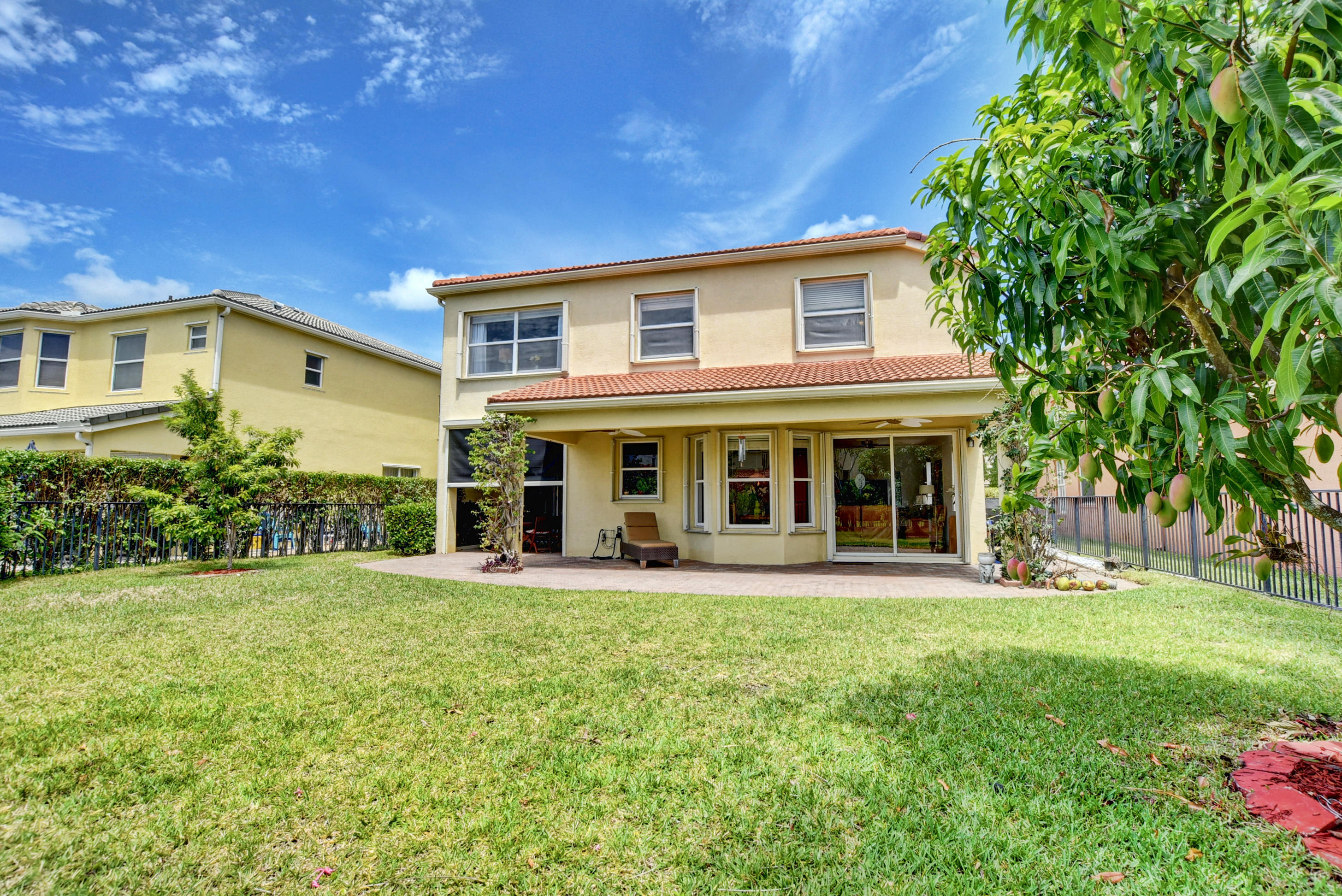 9744 Roche Place Wellington, FL 33414 - Photo 33 of 46 Backof house from garden