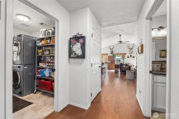 a view of an entryway with wooden floor