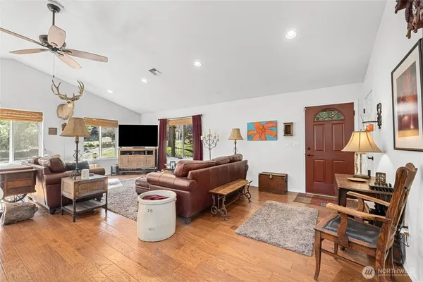 a living room with furniture and a flat screen tv