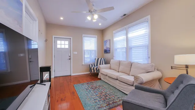 a living room with furniture and a rug