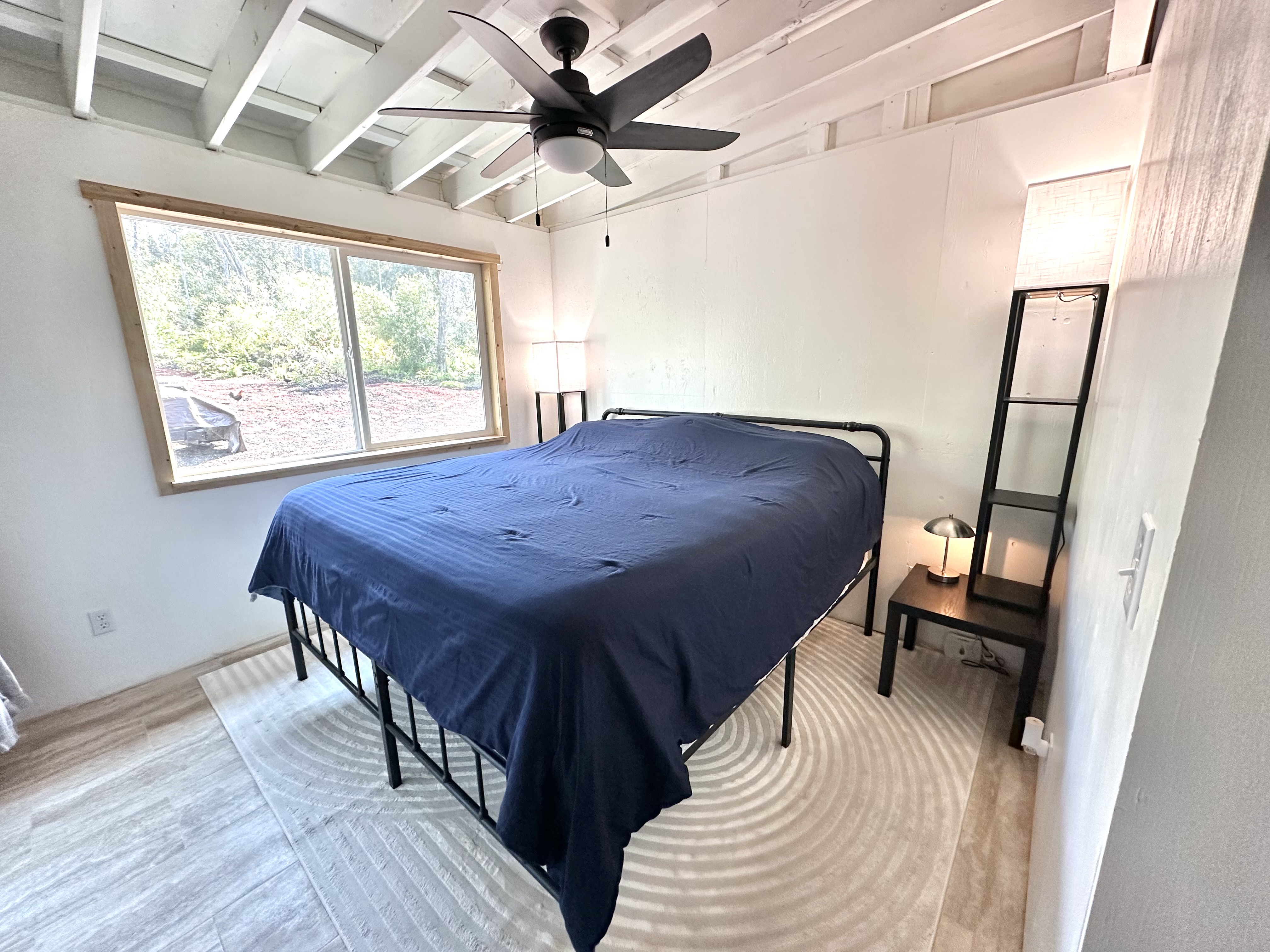 92-2083 Kailua Boulevard Ocean View, HI 96704 - Photo 13 of 30 a view of a dining room with furniture window and wooden floor
