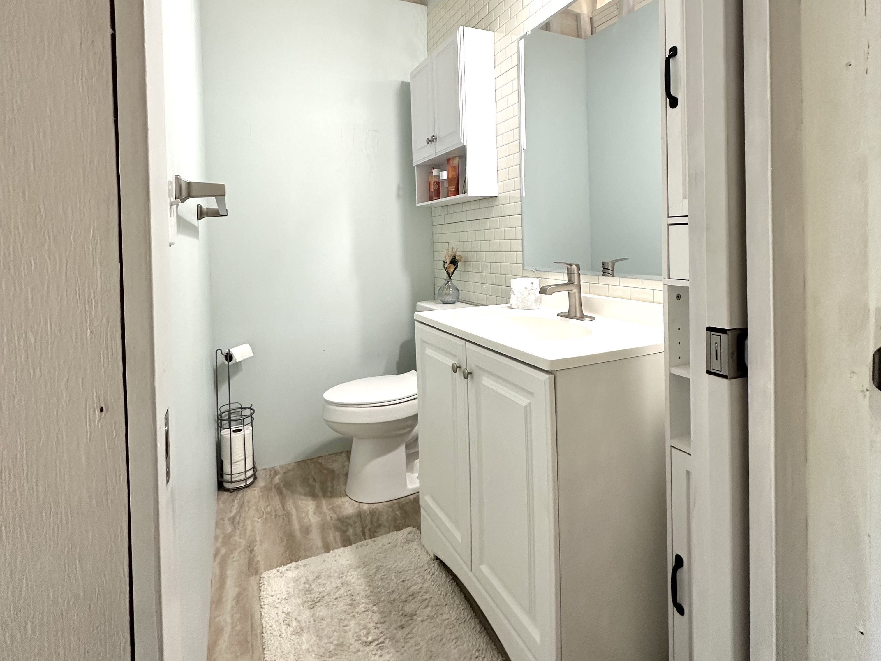 92-2083 Kailua Boulevard Ocean View, HI 96704 - Photo 14 of 30 a bathroom with a sink toilet and shower