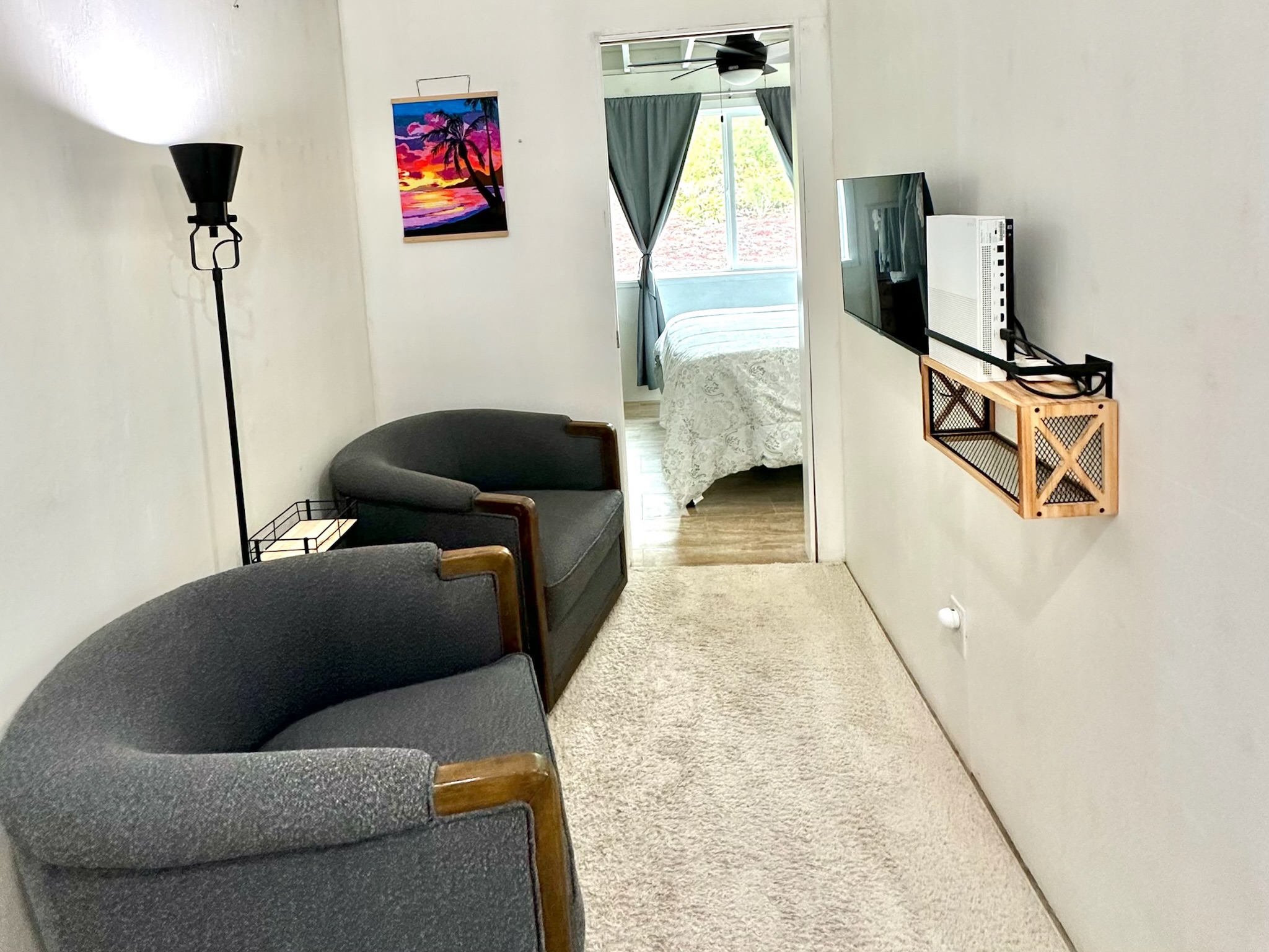 92-2083 Kailua Boulevard Ocean View, HI 96704 - Photo 18 of 30 a living room with furniture and a flat screen tv