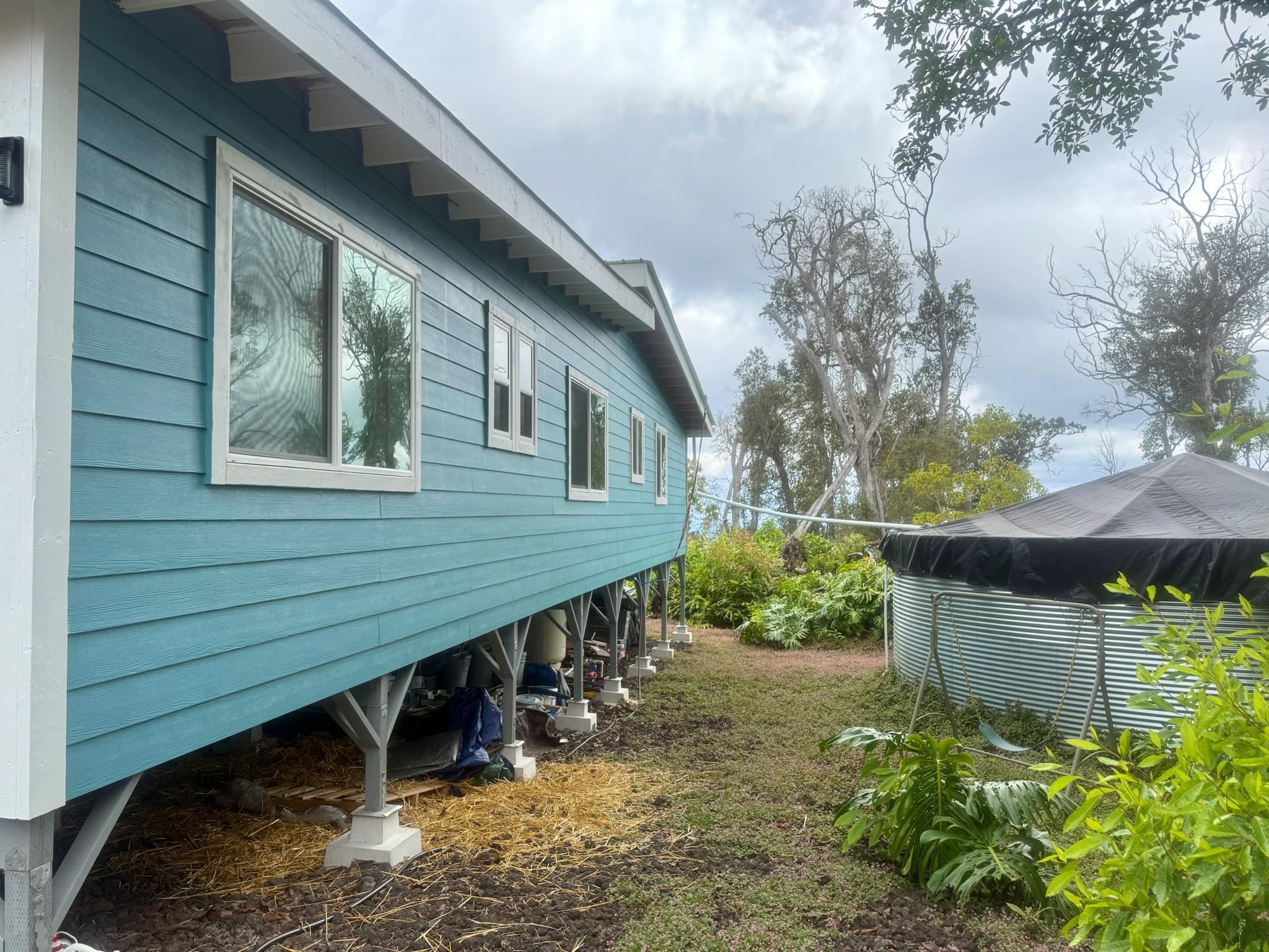 92-2083 Kailua Boulevard Ocean View, HI 96704 - Photo 28 of 30 a backyard of a house with lots of green space