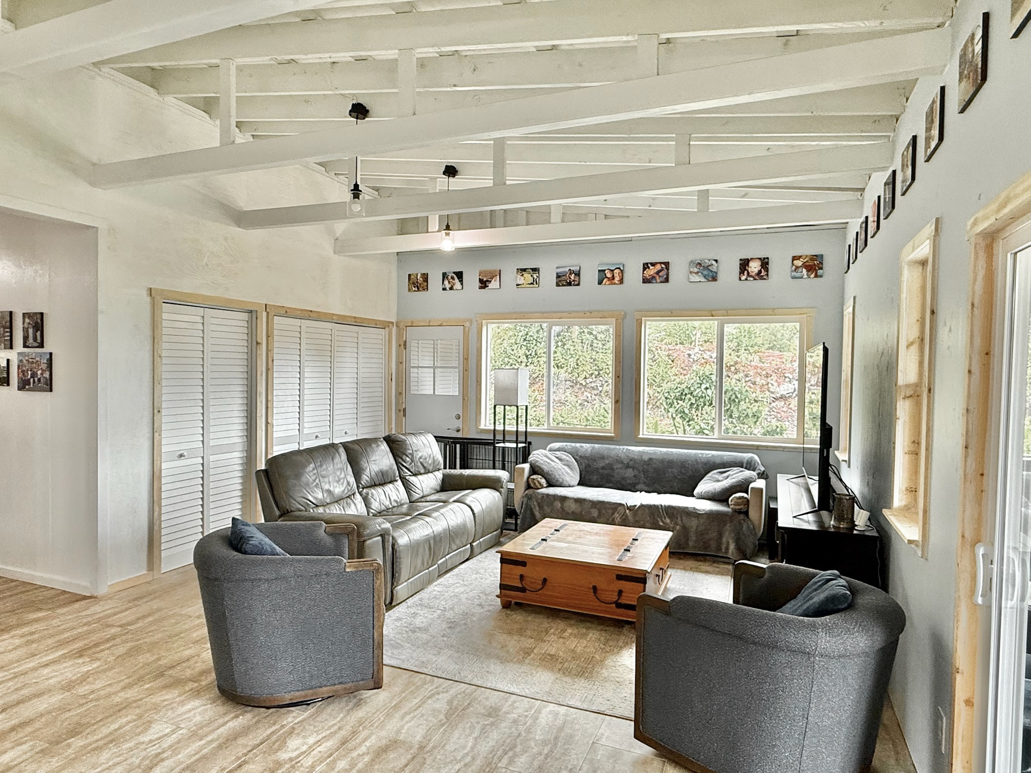 92-2083 Kailua Boulevard Ocean View, HI 96704 - Photo 3 of 30 a living room with furniture and a large window