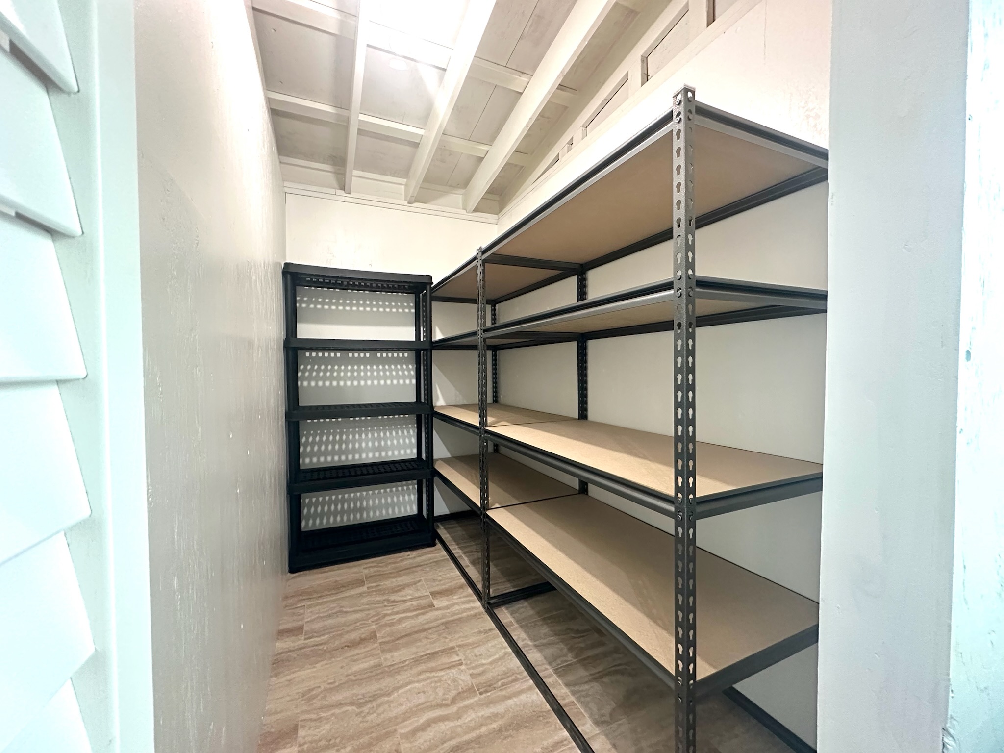 92-2083 Kailua Boulevard Ocean View, HI 96704 - Photo 7 of 30 a view of store room with empty racks