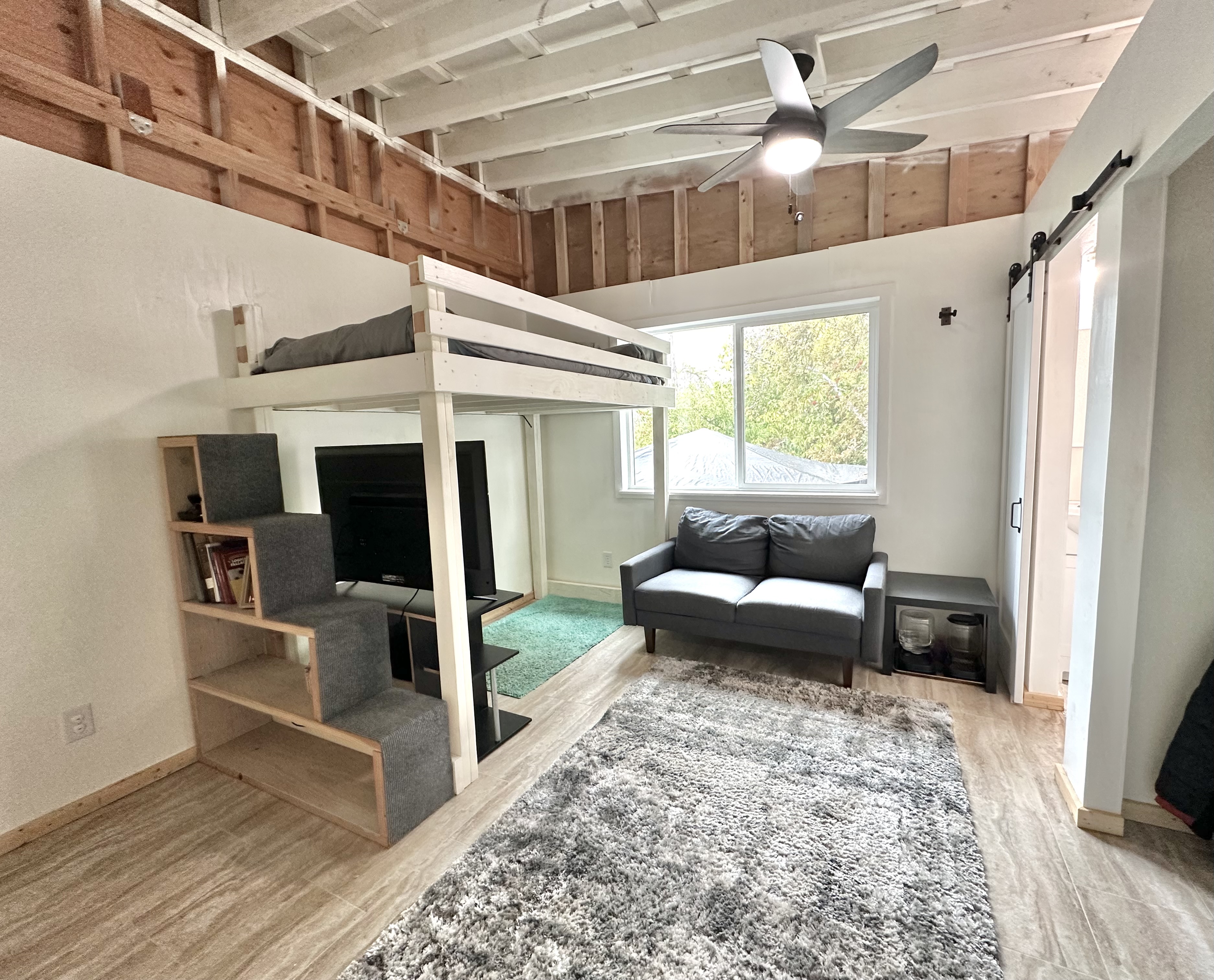 92-2083 Kailua Boulevard Ocean View, HI 96704 - Photo 9 of 30 a living room with furniture and a couch