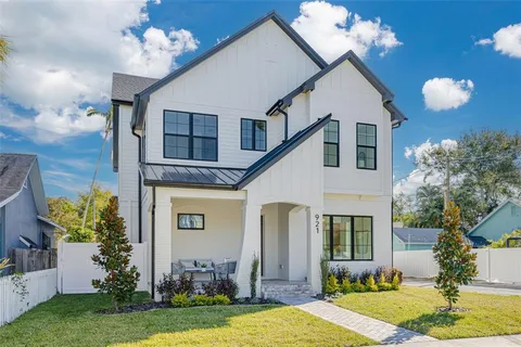 a view of multiple houses with yard