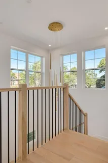 a view of room with furniture and wooden floor