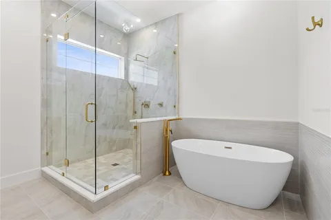 a bathroom with a bathtub and shower