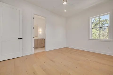 an aerial view of a house with a garden and swimming pool