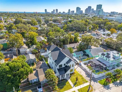 an aerial view of residential houses with outdoor space