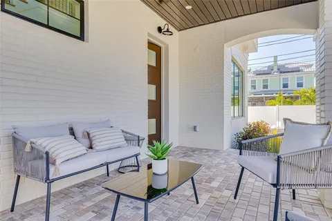 a living room with furniture white walls and white walls