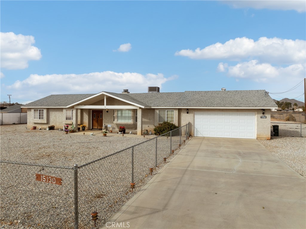 15130 Cheyenne Road Apple Valley, CA 92307 - Photo 1 of 1 a view of house with yard and sitting area