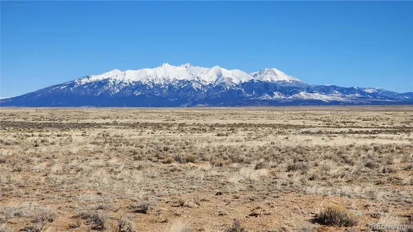 a view of a house with a mountain in the background