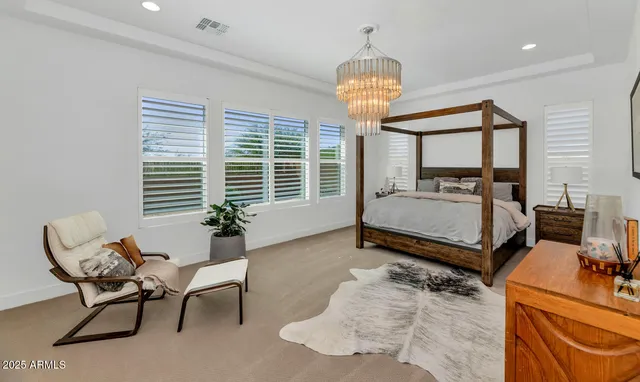 a bedroom with furniture and a bed