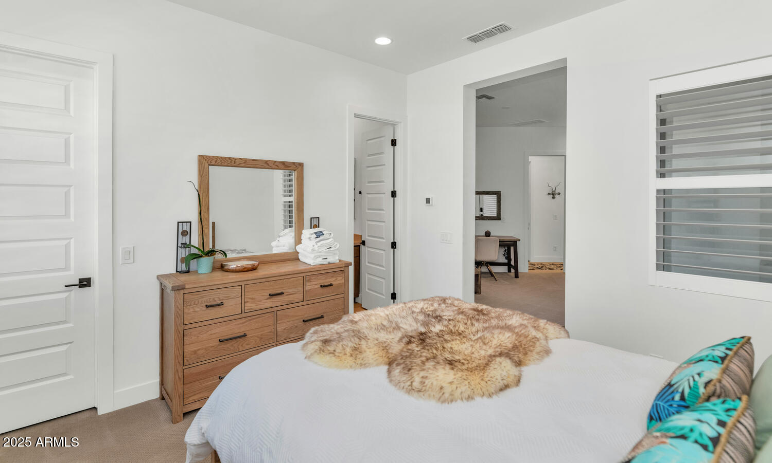 2041 East Fallen Leaf Lane Phoenix, AZ 85024 - Photo 19 of 31 a bedroom with a bed and a dresser
