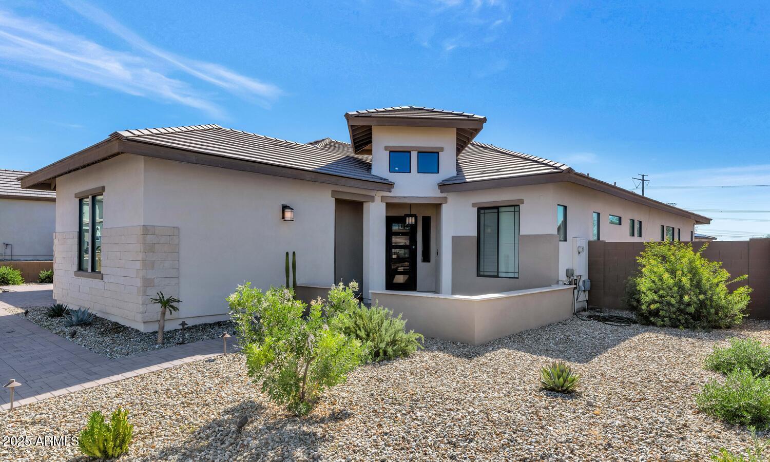 2041 East Fallen Leaf Lane Phoenix, AZ 85024 - Photo 2 of 31 a front view of a house with garden