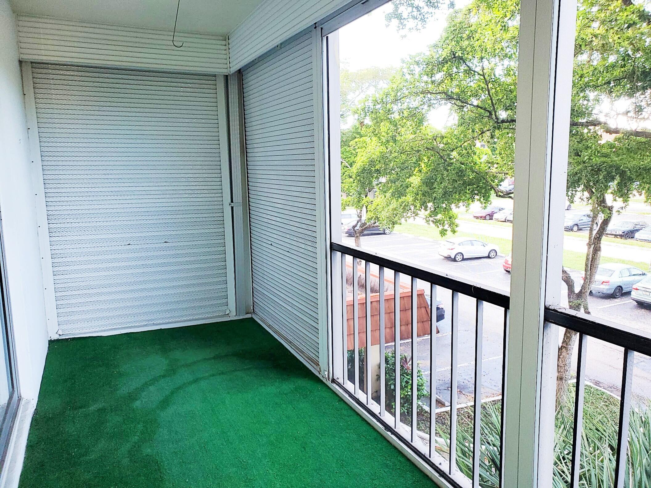 4156 Inverrary Drive, Unit 305 Lauderhill, FL 33319 - Photo 13 of 13 a view of a backyard with garden