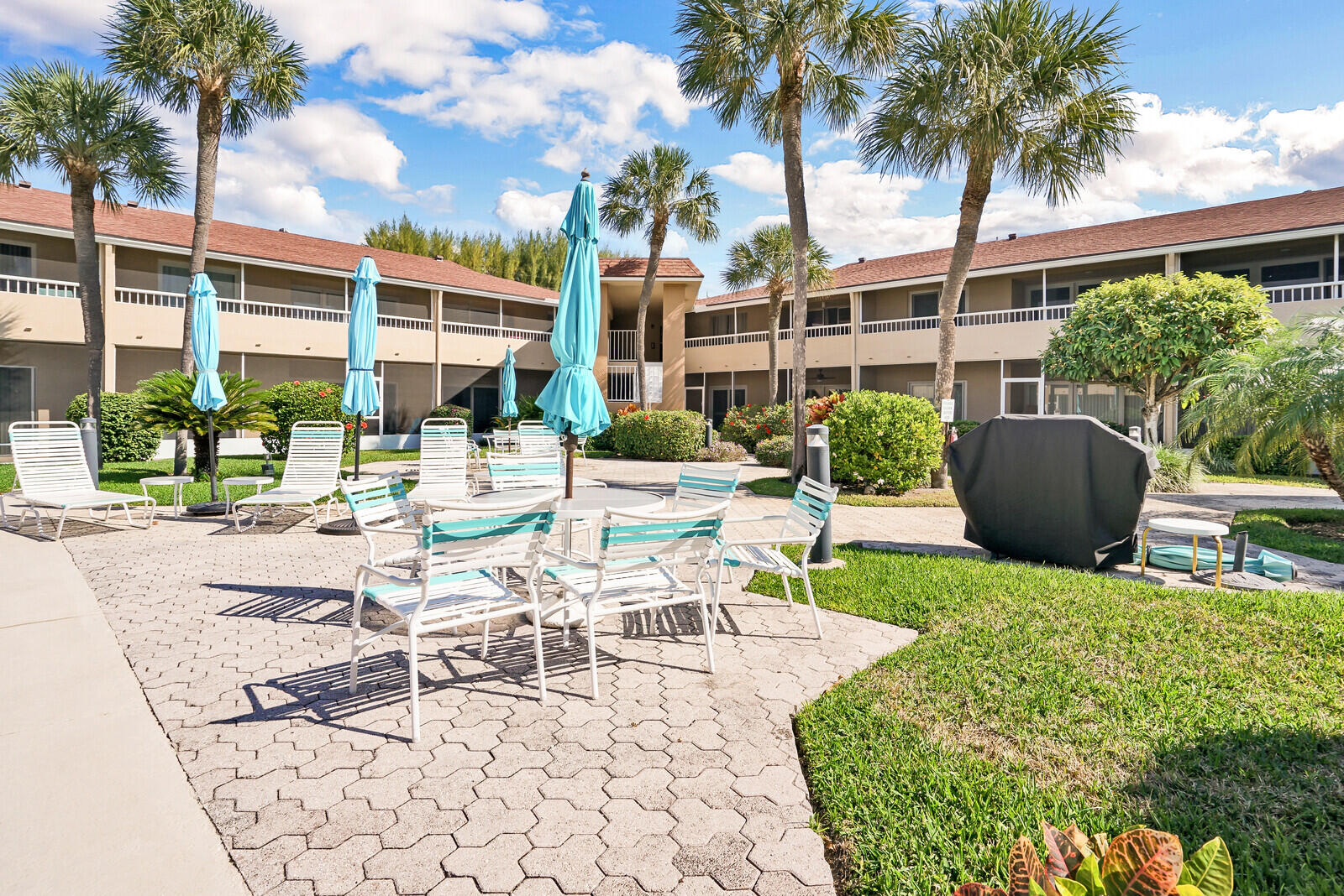 1100 Surf Road, Unit 106 Singer Island, FL 33404 - Photo 23 of 39 Courtyard Pool Area
