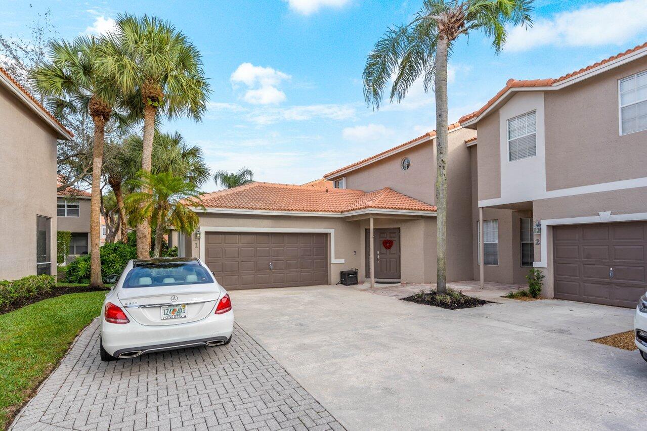 20970 Vía Azalea, Unit 1 Boca Raton, FL 33428 - Photo 3 of 60 Front