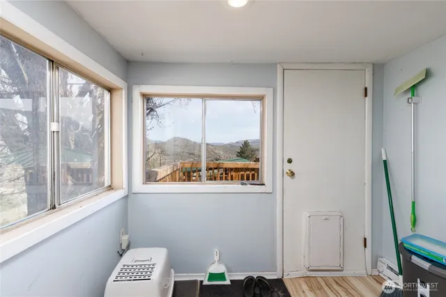 a view of room with window and a wooden floor