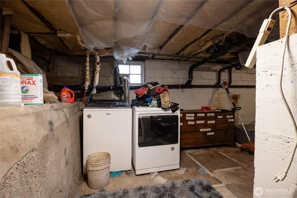 a storage room with washer and dryer