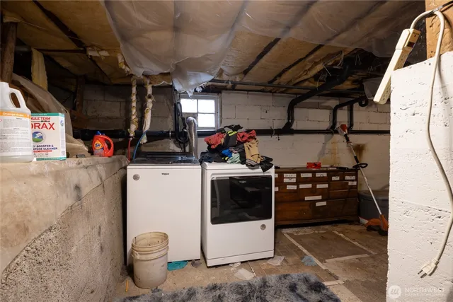 a storage room with washer and dryer