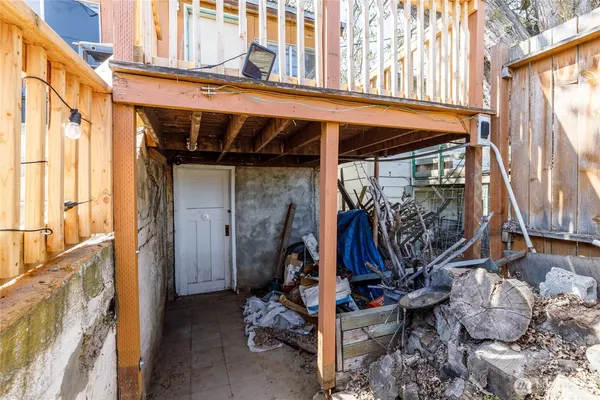 a view of house with deck and outdoor seating