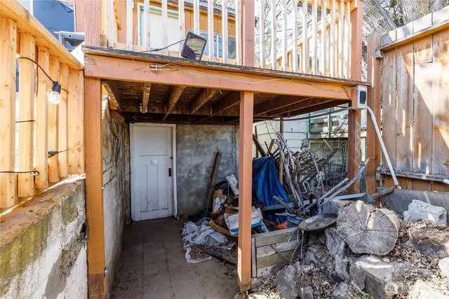 a view of house with deck and outdoor seating