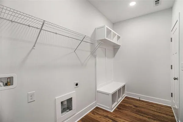 a view of room with window and wooden floor
