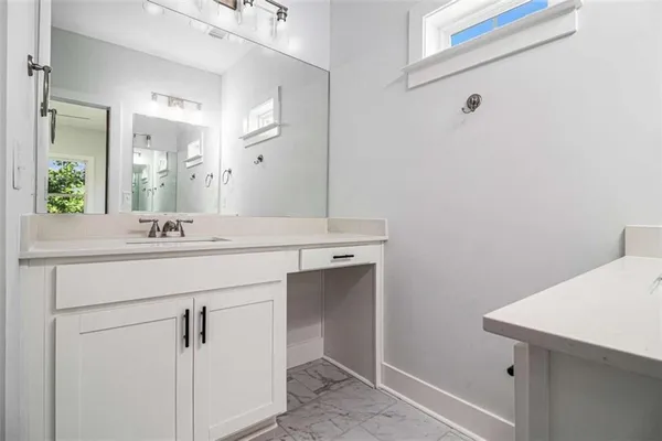a bathroom with a sink and a mirror