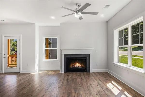 a living room with a fireplace and a window