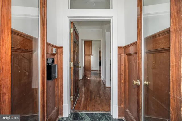 a view of a bathroom from a glass door