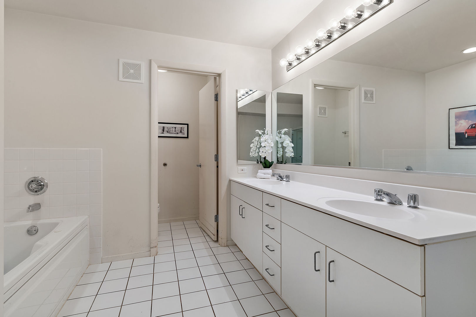 392 Kelburn Road, Unit 122 Deerfield, IL 60015 - Photo 10 of 22 a spacious bathroom with a granite countertop sink a mirror and a bathtub