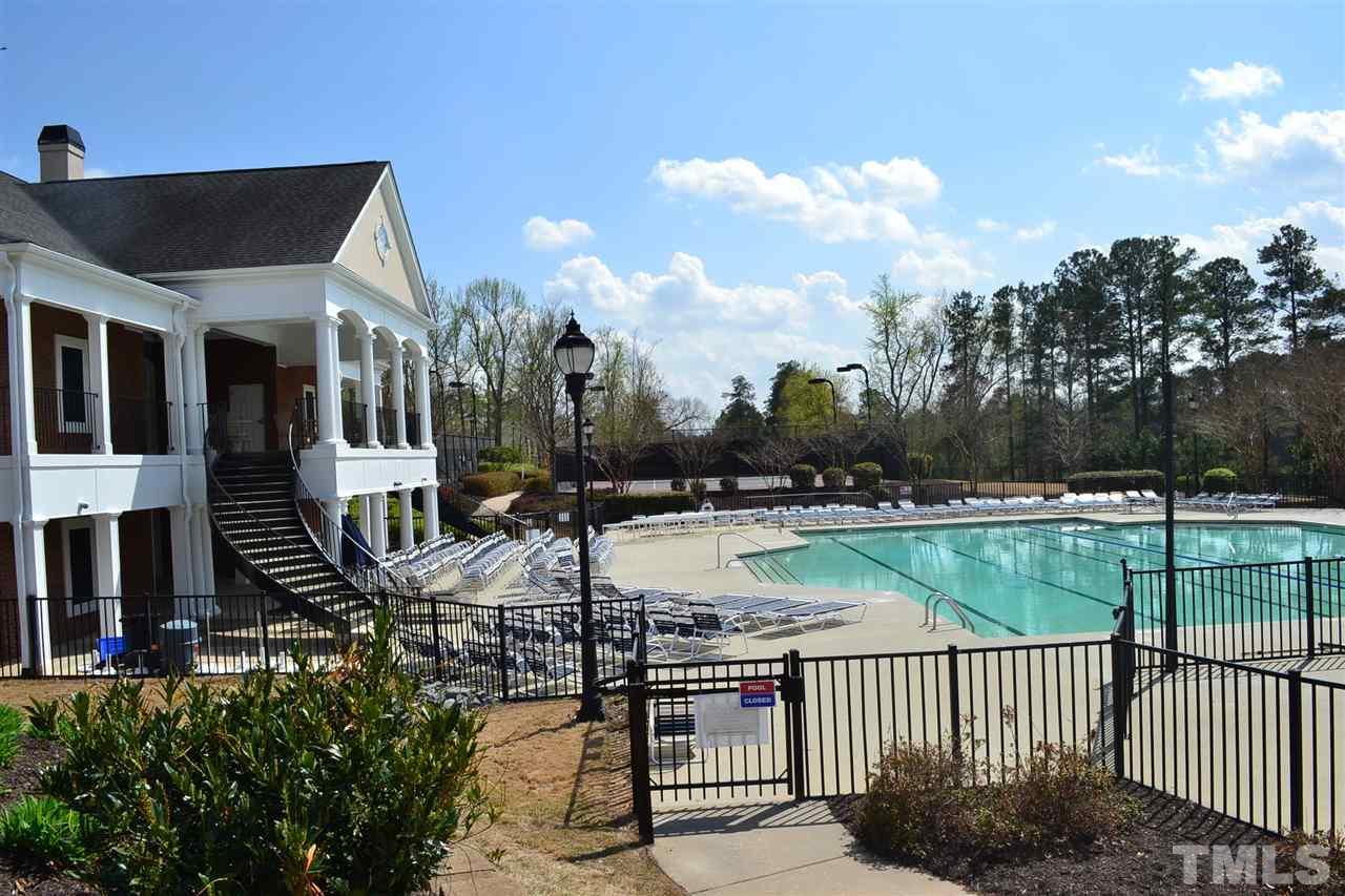 8107 Rhiannon Road Raleigh, NC 27613 - Photo 22 of 24 a view of a house with backyard and sitting area