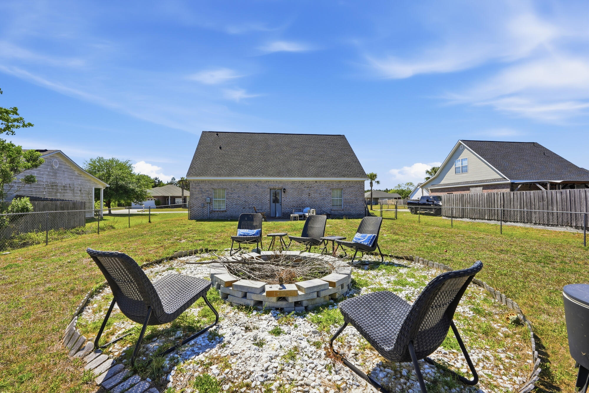 573 Tropical Way Freeport, FL 32439 - Photo 27 of 32 Back Yard and Fire Pit