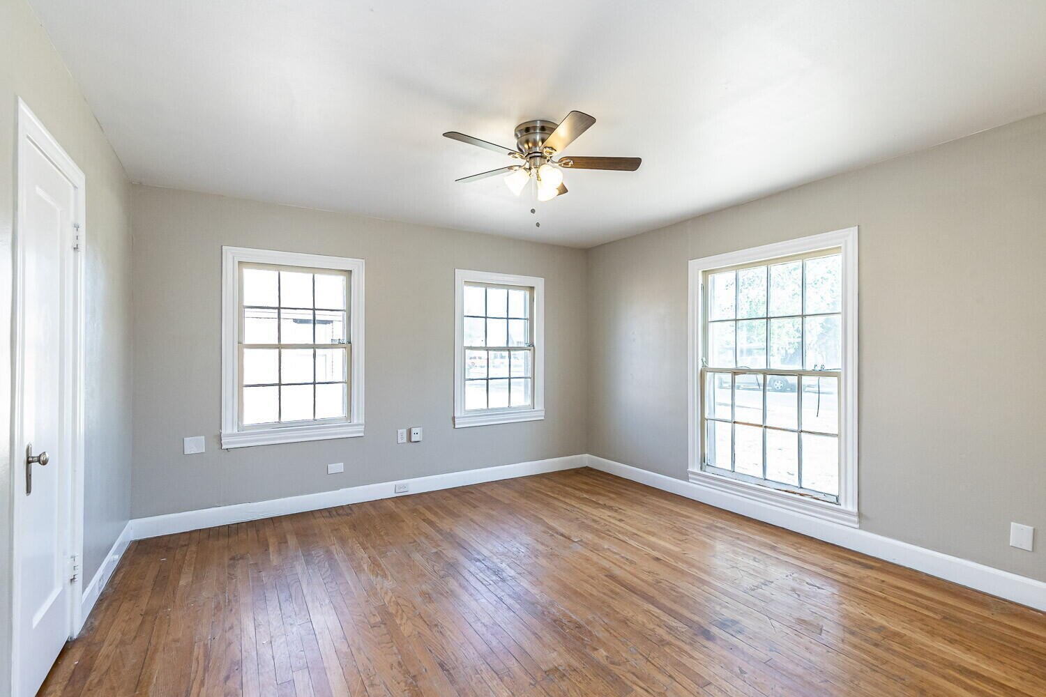 1914 25th Street Lubbock, TX 79411 - Photo 12 of 48 a view of empty room with wooden floor and fan
