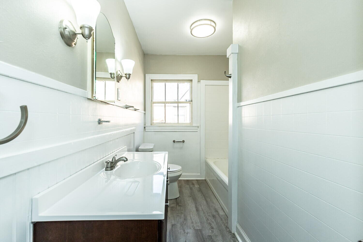 1914 25th Street Lubbock, TX 79411 - Photo 14 of 48 a bathroom with a sink a toilet and a window