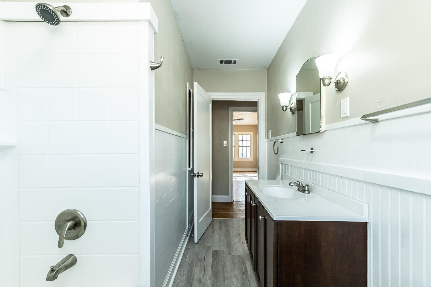 1914 25th Street Lubbock, TX 79411 - Photo 16 of 48 a bathroom with a sink and a mirror